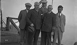 L. to R.: (front row): Major D.L. McKeand Capt. W.J. Balcon (back row): E.C. Green Inspector K. Duncan Douglas Leechman on board G.C.S. "N.B. M cLean" 24 August 1936.