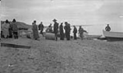 Passengers assembling for return to NASCOPIE by motorboat 4 September 1936.