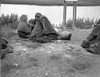 Inuit woman smoking a pipe 1944