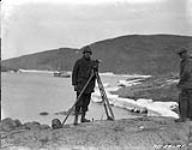 F.D. Henderson, D.L.S., making survey of group lot no. 2134. This survey on Rice Strait is the most northerly in Canada being in lattitude 78ï47'N 1924