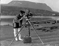 [Greenland Inuk woman examining moving picture machine]. Original Title: Greenland Eskimo woman examining moving picture machine 1924