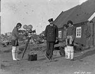 [Three Greenland Inuit women and Mr. Lemieux, 2nd Officer C.G.S. "Arctic" at Qeqertarsuaq]. Original Title: Three Greenland Eskimo women and Mr. Lemieux 2nd Officer C.G.S. "Arctic" at Godhavn 1924