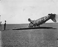 Consolidated [20] Fleetster [Type 2 aircraft CF-AIP]. Upside down with care Prairie Air mail, Medicine Hat Airport 1931. Pilot Jock Jarvis 1931
