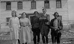 [Dr. & Mrs. Bourget, their daughter, and two Indigenous chiefs] Original title: Dr. & Mrs. Bourget, their daughter, and two Indian Chiefs 1924