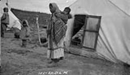 [Inuk woman with child, Tsiigehtchic, ca. 1921] Original title: Arctic Red [River, N.W.T.] Eskimo girl and child, ca. 1921 1921