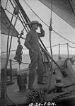 Mr. Henderson on bow of "Arctic" 1924