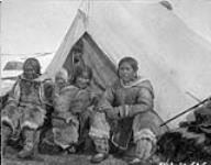 [Inuit women and children in front of a tent] Original title: Natives at camp 1927