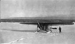 [Fokker 'Super Universal' aircraft G-CASQ of Western Canada Airways, Winter operations on Mackenzie River, [N.W.T.] [ca. 1930].