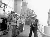 Ratings mustered along the starboard side of H.M.C.S. ASSINIBOINE at sea, ca. September 1940 [ca. September 1940].