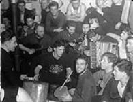 A singsong in the seamens' mess aboard H.M.C.S. ST LAURENT off Iceland, January 1942 January 1942.