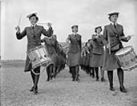 Drummers Joan McMaster and Lorraine McAuley leading a parade of Women's Royal Canadian Naval Service (W.R.C.N.S.) personnel, H.M.C.S. CONESTOGA, Galt, Ontario, Canada, June 1944 June 1944.