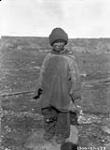 Inuit boy in coat of clothing made from flour sacks. S.W. Belchers 1927