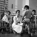 [Physiotheraphy at] Charles Camsell Indian Hospital [Edmonton, Alta., October 1958.] Oct. 1958.