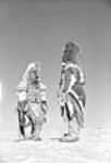 [Children dressed in beaded "artiggi" costumes, Padlei, N.W.T.] [Feb. 1950]