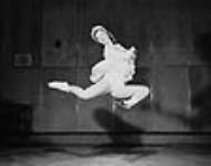 Barbara Ann Scott doing a "Stag Jump," Minto Skating Club Dec. 1947