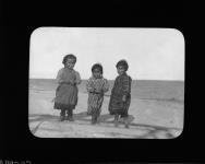 [Inuit children] Original title: Full figure portrait of three Indian (?) children 1910-1922.