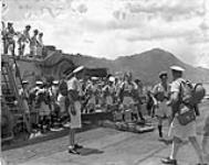 Landing party disembarking from H.M.C.S. PRINCE ROBERT during the liberation of Hong Kong, ca. 30 August 1945 [c.a. August 30, 1945]