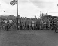 Canadian and British prisoners-of-war awaiting liberation by the landing party from H.M.C.S. PRINCE ROBERT, Hong Kong, ca. 30 August 1945 [c.a. August 30, 1945.]