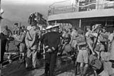 Infantrymen of "C" Company, Royal Rifles of Canada, disembarking from H.M.C.S. PRINCE ROBERT, Hong Kong, 16 November 1941 November 16, 1941.