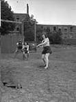 Baseball game between women from the "Eager Beavers" and officers of the Regina Rifle Regiment, Netherlands, 31 August 1945 August 31, 1945.