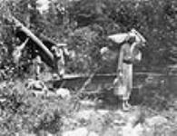 One of the pleasures of a canoe trip (coming to the end of a mile portage), [Timiskaming District, Ont., ca. 1897.] 1897