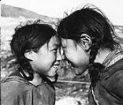 Inuit children rubbing noses ca. 1940-1948.