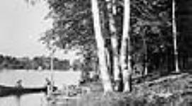 W.L. Mackenzie King and unidentified woman in canoe 25 July 1920