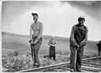 Augustinas Kuolas, left and P. Markonis, Lithuanian immigrant railway workers, 1948