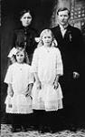 "Mother, father, Ingrid & I [Lempi D. Mansfield] in Cobalt, [Ontario]." 1914