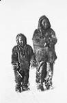 Kopann'na (boy ca.10yrs. son of Ivarluk, Rae River) and Kaioran'na (boy ca. 4yrs), wearing coats of skins of Parry Ground Squirrel, Coronation Gulf, Stefannson-Anderson Arctic Expedition 1908-1912 11 Apr. 1911.