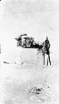 A platform cache made from snowblocks to raise goods above reach of dogs, Coronation Gulf, Stefansson-Anderson Arctic Expedition, 1908-1912, 9:30 a.m 15 Apr. 1911.