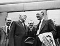 Rt. Hon. Louis St. Laurent greeting Hon. F. Gordon Bradley, head of the delegation to negotiate the union of Newfoundland with Canada. Other members of the delegation at rear are J.R. Smallwood and G.F. Higgins June 1947
