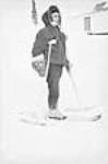 Cree man with a snowshoe and snow crutches 1947-1948.