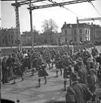 Pipe band of The Essex Scottish Regiment marching across a bridge which had been captured by the regiment, Groningen, Netherlands, 17 April 1945 April 17, 1945.