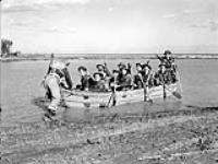 Infantrymen of The Royal 22e Regiment training in a collapsible canvas boat near Cattolica, Italy, 24 November 1944 November 24, 1944.