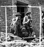Canadian officers directing mortar fire, May-sur-Orne, France, 9 August 1944 August 9, 1944.