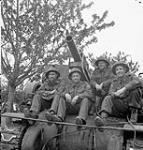 Personnel of the 34th Battery, 14th Field Regiment, Royal Canadian Artillery (R.C.A.) with a 'Priest' self-propelled gun, France, 20 June 1944 June 20, 1944.