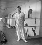 Merchant Navy wireless operator O.H. Collett, a liberated Canadian prisoner-of-war, aboard the hospital ship S.S. BENEVOLENCE, Yokohama, Japan, 3 September 1945 September 3, 1945.
