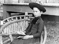 Lillie Ballantyne in rustic chair 1889