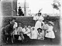 Group photograph - Mrs. Barry with Ms. Turner and children 1897.