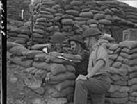 [Officers of Baker Company, 3rd Battalion, P.P.C.L.I., undergoing briefing before night patrol, Korea, 12 June 1953.] 12 June 1953