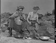 [Personnel of the 3rd Battalion, P.P.C.L.I., stripping and cleaning weapons, Korea, 2 July 1953.] 02-Jul-53