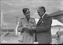 Lord Beaverbrook with Group Captain K.M. Guthrie at R.C.A.F. Station 23 Aug. 1941