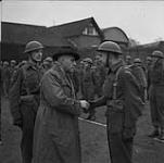 Colonel The Honourable J.L. Ralston, Minister of National Defence, with Canadian troops Dec. 1940