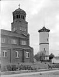 Roman Catholic Church and water tower Oct. 1949
