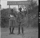 Lieutenant-Colonel R.M. Crowe and Major J.H.W. Pope of the Royal Canadian Regiment checking 17 July 1943