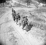Unidentified Canadian infantrymen advancing towards Melfa, Italy, 23 May 1944 May 23, 1944.