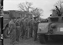 General Keller, General Officer Commanding 3 Division, inspecting 3 Division Signals Stag Hound armoured car of Royal Armoured Corps 14 Apr. 1944