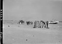 Carrying rations ashore, Normandy beachhead 7 June 1944
