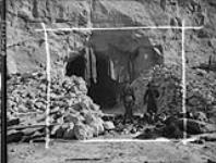 Entrance to stone quarry cave used by Germans to store trucks and equipment 10 Aug. 1944